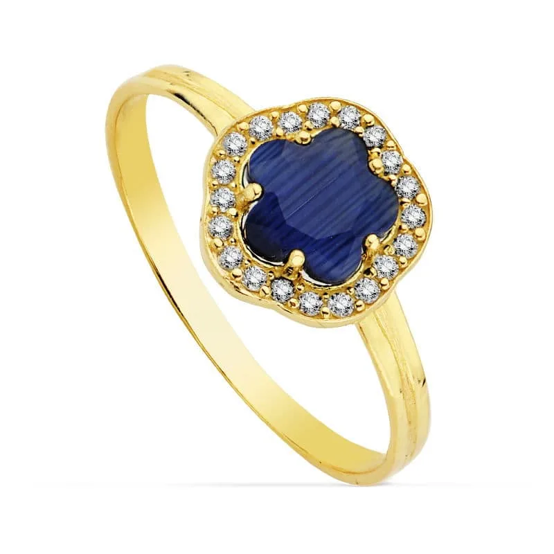 18K SORTIJA ORO AMARILLO CON CIRCONITA FLOR AZUL. ANCHO: 9 X 9 MM